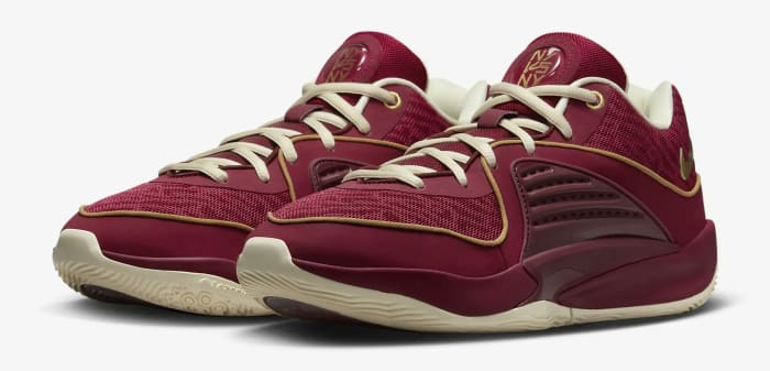 Side view of Kevin Durant's red and gold basketball shoes.